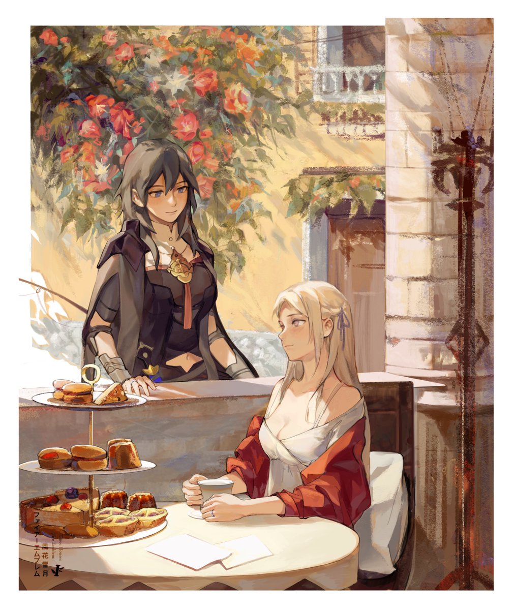 two women are in a streetside cafe. a woman with long black hair is standing behind a table laden with pastries, cakes, and sandwiches. a woman with long blond hair is sitting at the table holding a teacup. a rose bush hangs over the cafe from the building above.