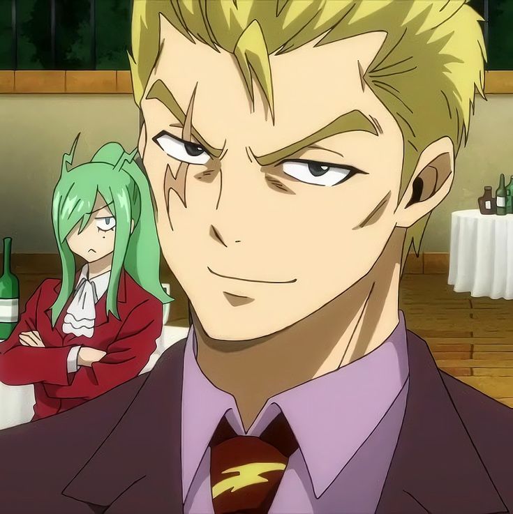 the image shows a man and a woman in an anime style. the man is in the foreground and is wearing a suit and a tie with a lightning bolt design. he has blond hair and is smiling mischievously. the woman is in the background, to the left of the man, and is wearing a red jacket and white shirt. she has green hair and looks serious.
