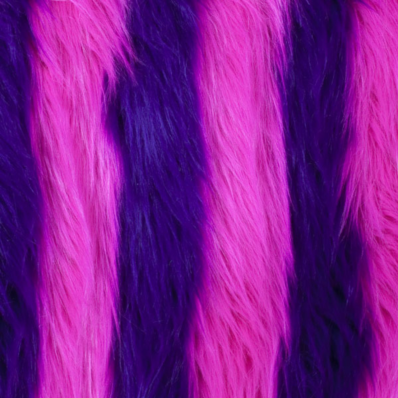 the image shows a closeup view of a furry textile with alternating pink and purple stripes. the fur appears soft and has a smooth texture.