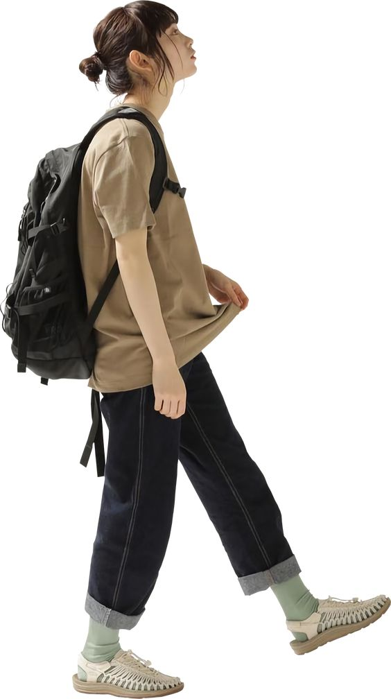 a young woman is captured midstride, her gaze directed upwards. she embodies a casual and carefree style with a loosefitting, shortsleeved tshirt, relaxed fit jeans, and comfortable sandals.  a black backpack suggests a sense of adventure and readiness for exploration. the bright, natural lighting hints at a pleasant day for outdoor activities.