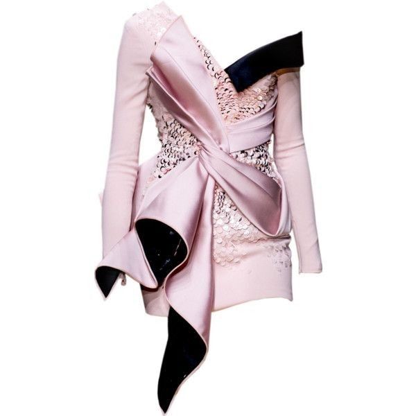 the image shows a pink cocktail dress with a large satin bow and black accents. the dress features long sleeves and is adorned with sequins. it has an asymmetrical design, with the bow creating a dramatic effect.
