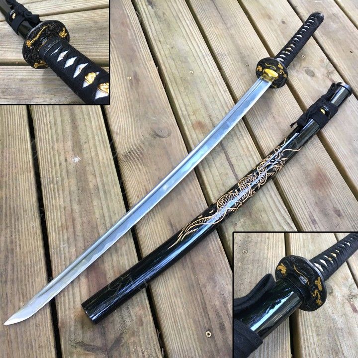 an image displays a katana sword lying on a wooden surface next to its black, golddecorated scabbard. the katana's blade is silver, and its handle is black with gold accents. closeup shots of the handle and scabbard's end are also included. the entire arrangement rests on a backdrop of wooden planks.