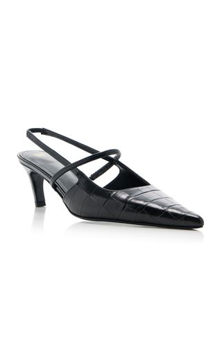 a pair of black leather heeled shoes with a slingback design. the shoes have a pointed toe and a high heel. they are made of a textured leather that gives the appearance of crocodile skin. the shoes are elegant and stylish, making them perfect for formal occasions or evening wear.