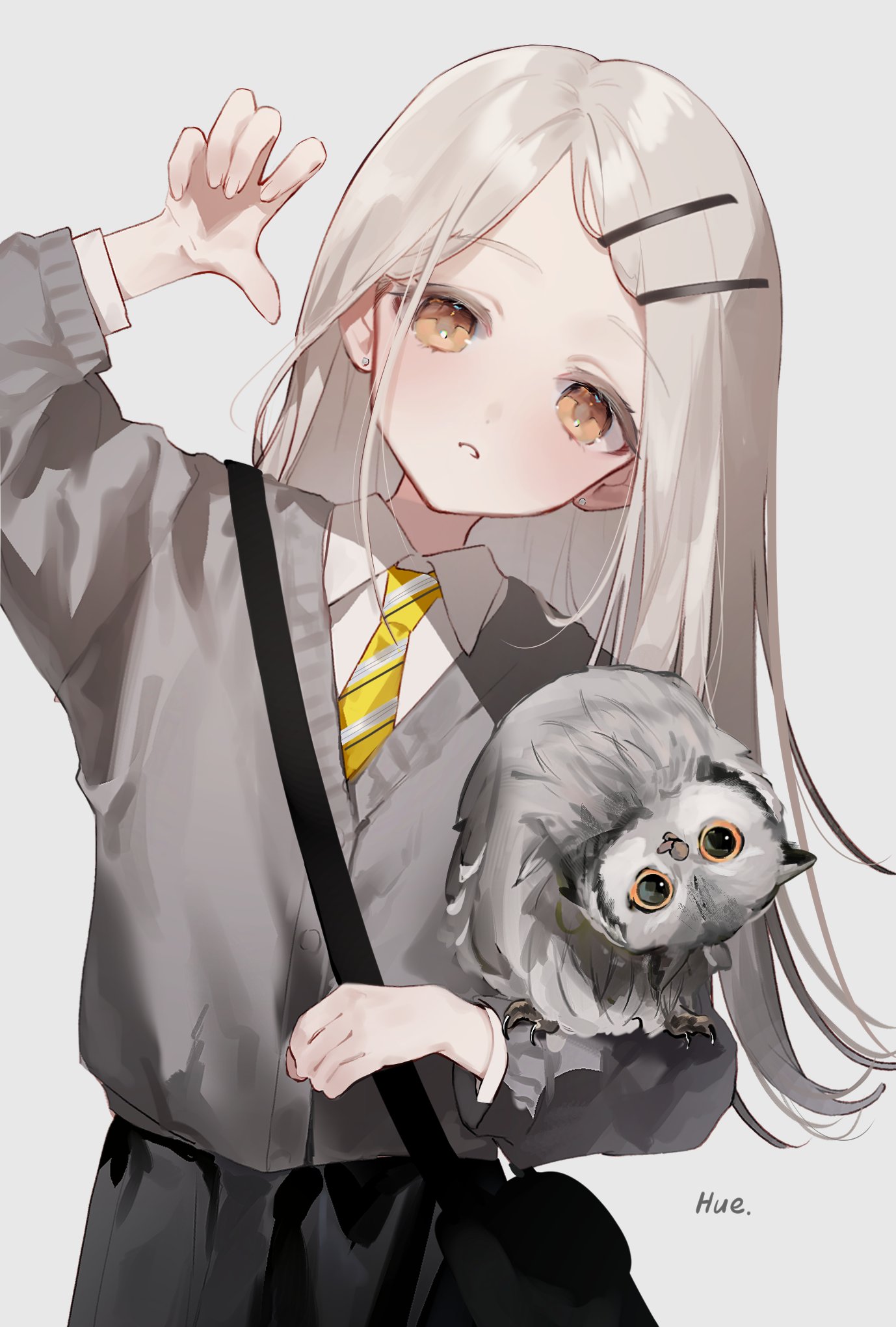 an animestyle illustration of a young girl with light gray hair, wearing a school uniform consisting of a gray sweater over a white collared shirt and a yellow tie with gray stripes. her hair is parted in the middle and held back with two dark hair clips. she has large, round amber eyes and a slight blush on her cheeks. she is holding her hand up with her fingers spread out. resting on her shoulder is a fluffy gray owl with big, curious eyes looking directly at the viewer. she has a black shoulder bag strap across her chest, and the "hue." signature is in the lower right corner. the background is a plain, light gray color.