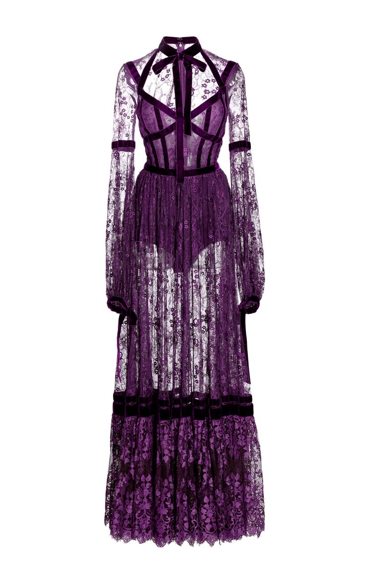 he image shows a long purple lace dress with velvet detailing. the dress has long sleeves, a high neck, and a fitted bodice.  the lace is sheer, revealing a velvet corset underneath. the skirt is flared and has a layered look. the overall style is elegant and formal, suitable for a special occasion.