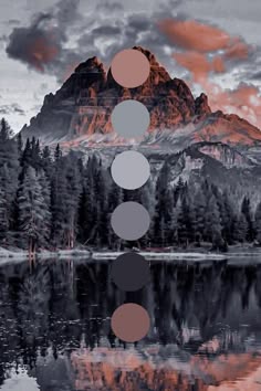 a beautiful mountain landscape with a lake in the foreground. the mountain is covered in trees and has a rugged and wild appearance. the sky is cloudy and has a redorange hue. the lake is calm and reflecting the sky and mountain. there are some color circles to the right of the image, seemingly reflecting the colors of the image in a minimal and abstract manner.  the overall feel of the image is peaceful and serene.