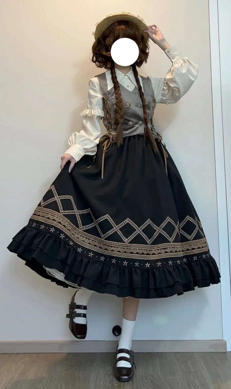 a person is wearing a lolita fashion outfit. the outfit consists of a white blouse with ruffled sleeves, a gray vest, and a black skirt with embroidered detailing and ruffles at the hem. they are also wearing white socks, brown mary jane shoes, and a straw hat. the person has long braids. the face is covered with a white circle.