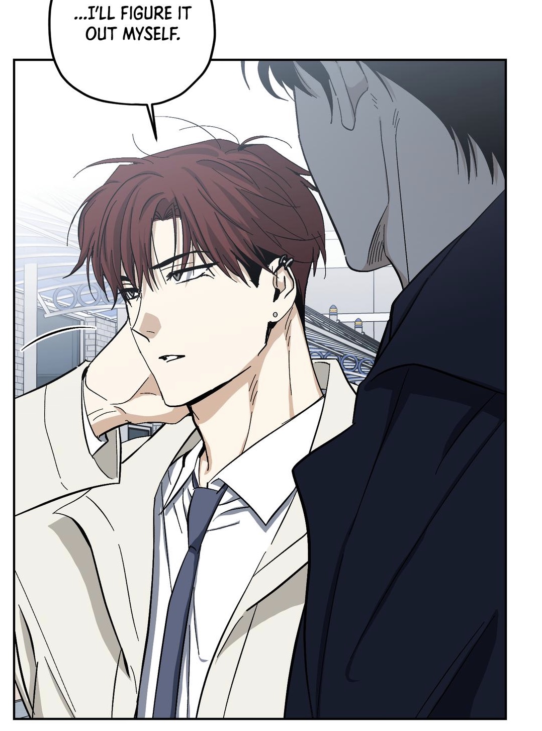 the image is a panel from a manhwa (korean comic) or webtoon. it shows a closeup of two men.  the man in the foreground, with reddishbrown hair and a light beige coat over a white shirt and dark tie, has a serious but determined expression.  he's adjusting his collar. a thought bubble above him says "...i'll figure it out myself."  behind him, partially visible, is another man in a dark jacket. the setting appears to be an indoor public space, possibly a train station or bus terminal, suggested by the blurry background elements. the overall tone is serious and introspective.