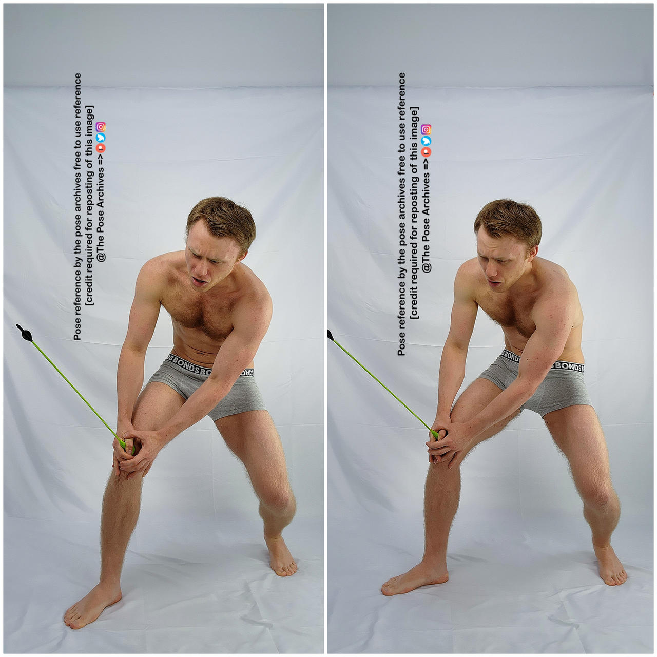 a man in his late 20s with short red hair is posing in a studio setting. he is shirtless and wearing gray boxer briefs. he is holding a green exercise band in both hands and appears to be experiencing pain in his left knee. the background is a plain white wall.