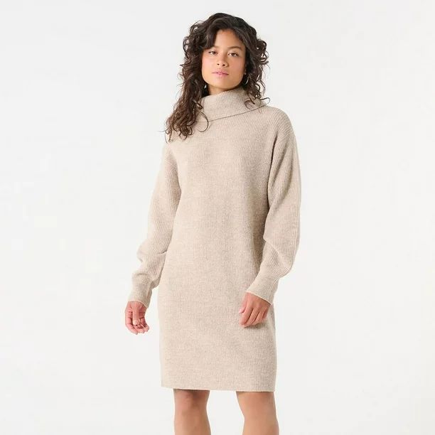 a full shot of a woman wearing a beige turtleneck sweater dress.  the dress is knit and has a relaxed, loose fit with long sleeves.  the woman has shoulderlength brown hair and is standing against a plain white background.  the overall style is casual and minimalist.