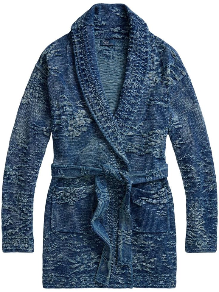 a women's blue denim knit robe with a long collar, pockets, and a belt. the robe is knitted in a textured pattern that gives it a casual look.