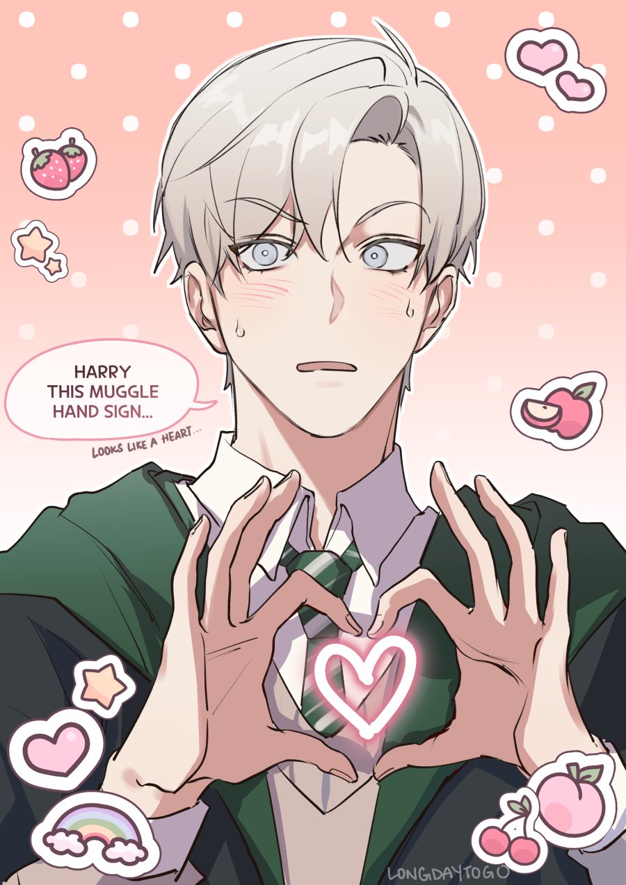 the image is a digital drawing or fanart in an anime/manga style.  it depicts a young, cute male character with silver/white hair wearing a slytherin school uniform (green robes and tie) from the harry potter series. he is making a heart shape with his hands, a "muggle hand sign" according to the text bubble, and is blushing. the background is pink with cute decorative elements such as hearts, strawberries, apples, and stars. the artist's signature, "longdaytogo," is visible at the bottom. the overall style is soft, sweet, and romantic.