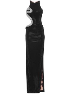 a black sleeveless maxi dress with a halter neckline. it features a cutout on the side and a side slit. the dress has a snake design embellishment made of sequins and rhinestones. the dress is shown on a model.