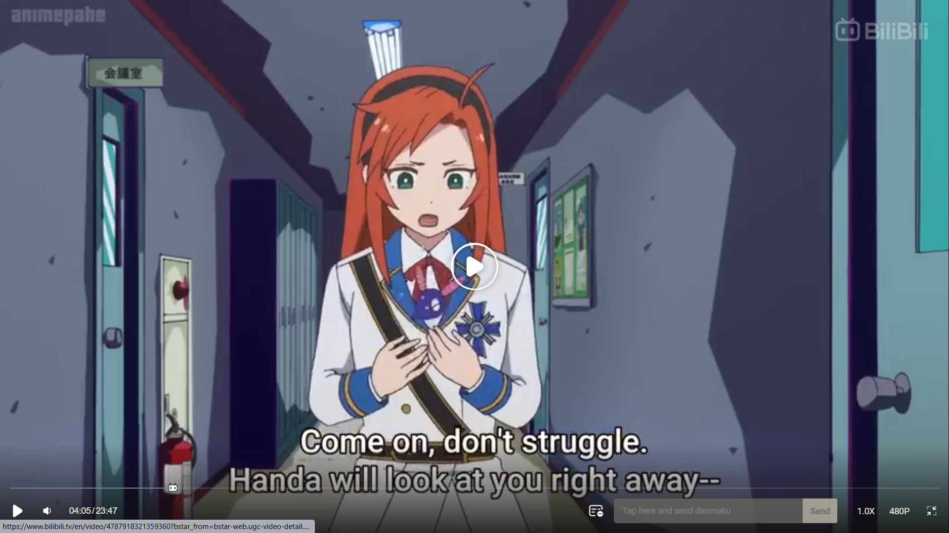 a screenshot from an anime showing a young woman with long orange hair and green eyes standing in a school hallway. she is wearing a white uniform with blue and gold accents and has a surprised and worried expression on her face.  she appears to be midconversation, as indicated by the dialogue box at the bottom of the screen. the hallway is brightly lit with artificial lighting.  overall, the image conveys a sense of urgency and concern.