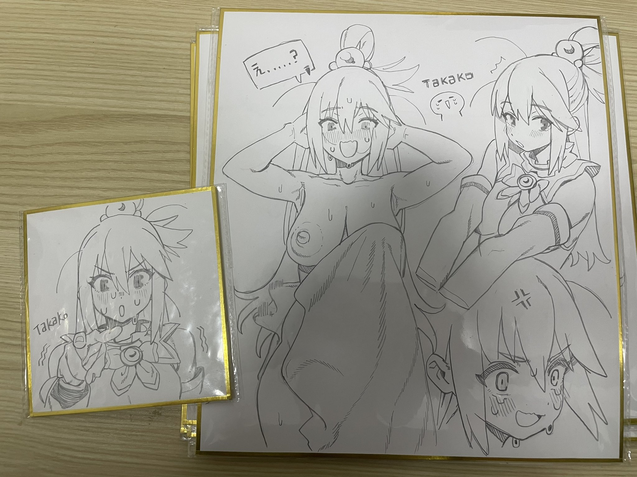 the image shows two framed sketches of the anime character aqua from konosuba. one sketch is smaller and shows aqua with an embarrassed expression. the larger sketch features multiple poses of aqua, including one that is nude from the waist up. the sketches are in black and white with simple line work.