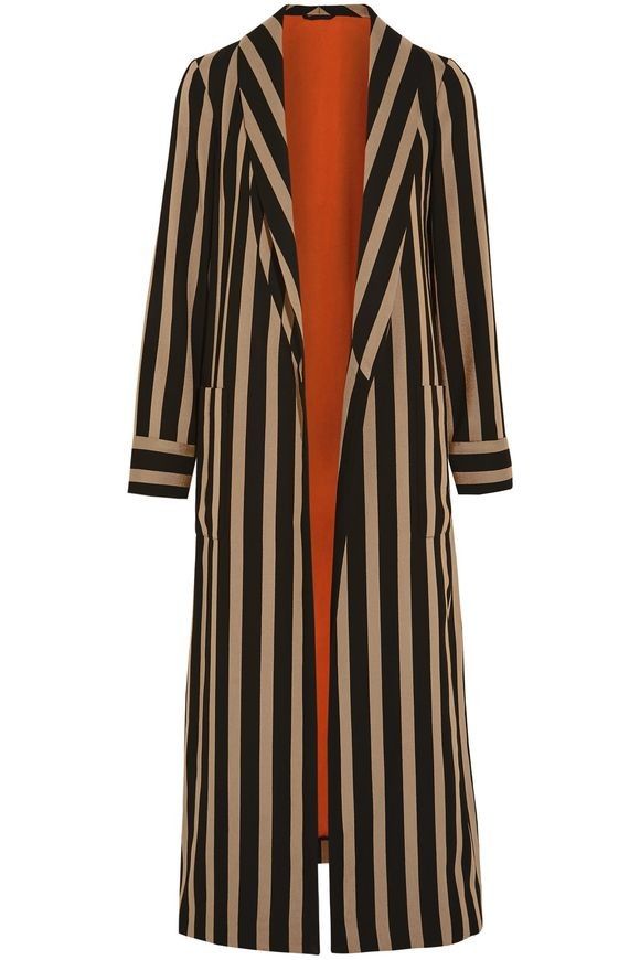 a long, vertically striped coat with an orange lining is displayed against a white background. the coat is unbuttoned, revealing the bright orange interior. it has long sleeves, a blazer style collar, and pockets on both sides. the stripes alternate between black and beige.