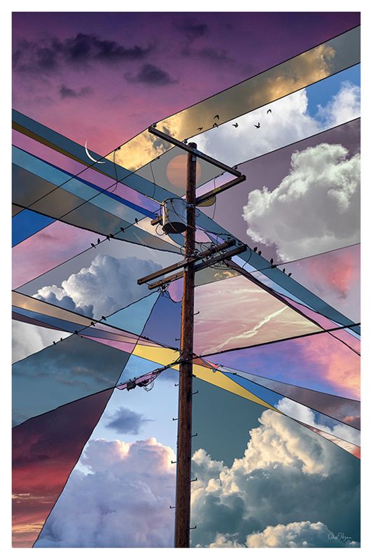 a wooden power pole is silhouetted against a vibrant sunset sky. the sky is divided into geometric shapes of various colors, creating an abstract and otherworldly effect. there are birds flying in the sky, and the wires that are connected to the pole are like a geometric frame around the image.