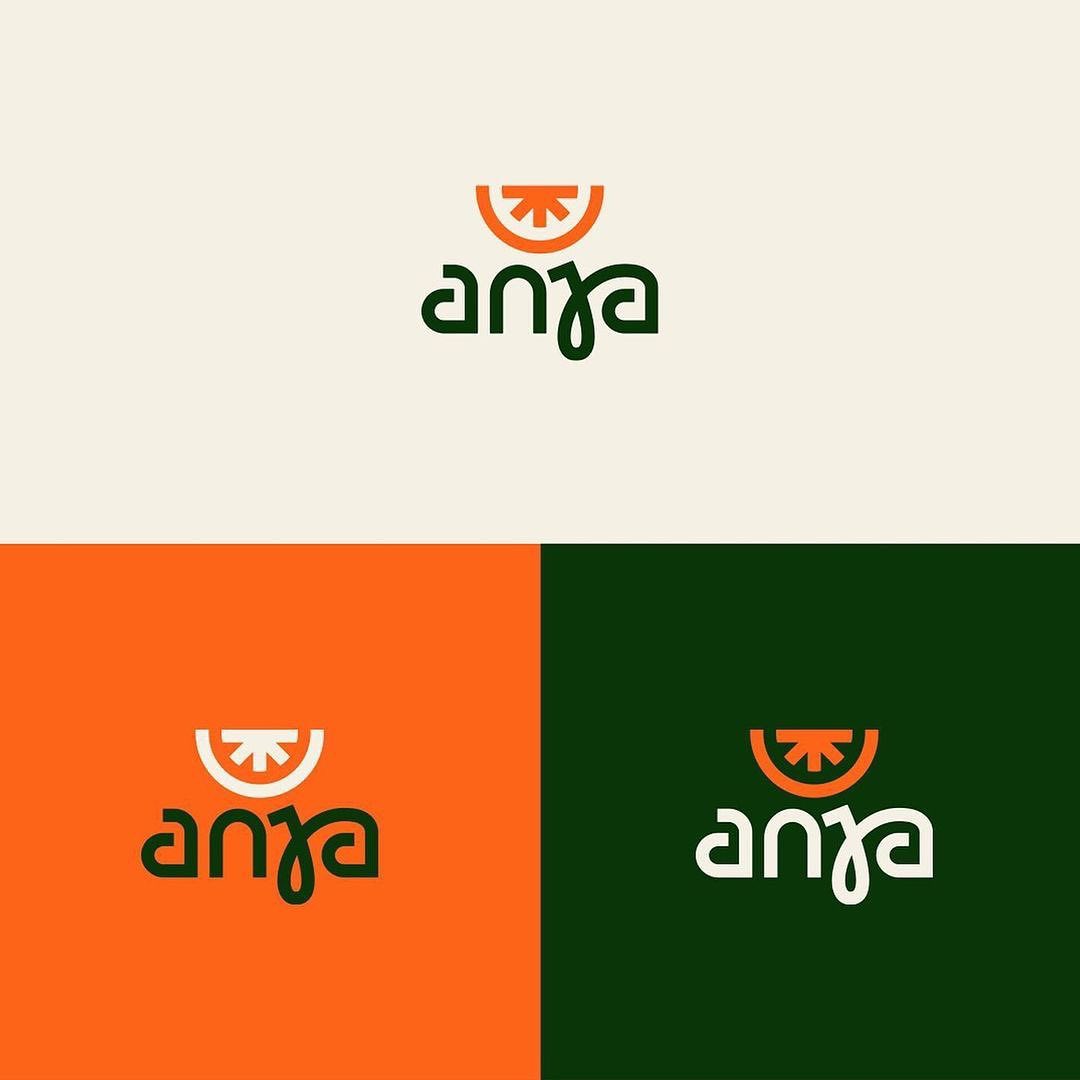 this image displays 4 variations of a logo design for a company named "anya". each logo variation showcases a simplistic design of a sliced fruit (presumably an orange) positioned above a bowl, with the company name "anya" written below in a stylized font. the background colors used in each variation are cream, orange, and green.