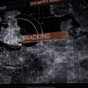 the image shows a digital screen displaying a map interface with the word "tracking" prominently displayed in an orange banner. the map shows continents and grid lines, with concentric circles indicating a tracking area or location. there are also other elements like "sub matrix indicator" and "hub" visible on the screen, suggesting it's a sophisticated tracking system.