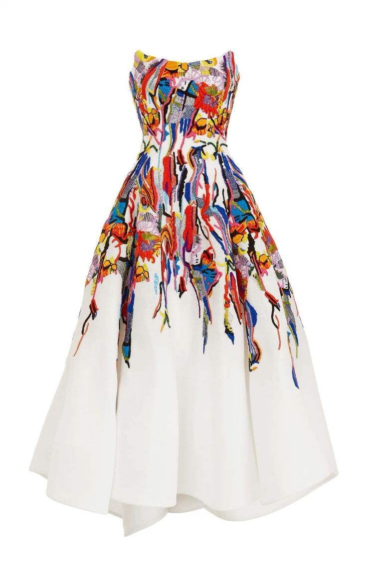 a white strapless dress with colorful floral embroidery. the dress is made of a lightweight fabric and has a flowy silhouette. it is perfect for a summer wedding, a formal event, or a night out.