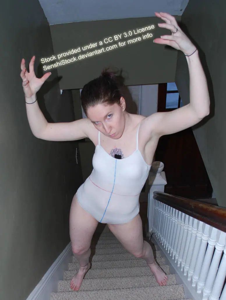 a woman is standing on the stairs, looking down. her hands are up, one reaching towards the camera. she is wearing a white bodysuit and is barefoot.  the stairs have a white railing on the right side of the image.