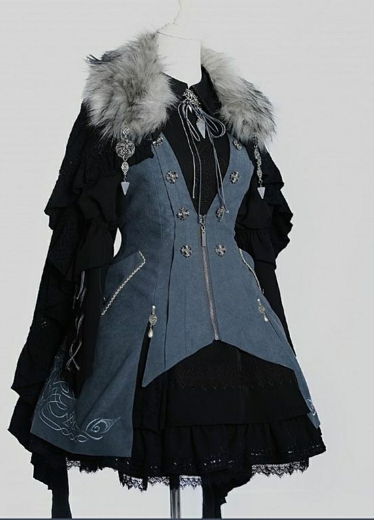 this is a studio shot of a gray and black lolita dress with a faux fur trimmed capelet. the dress features silver accents and embroidery.
