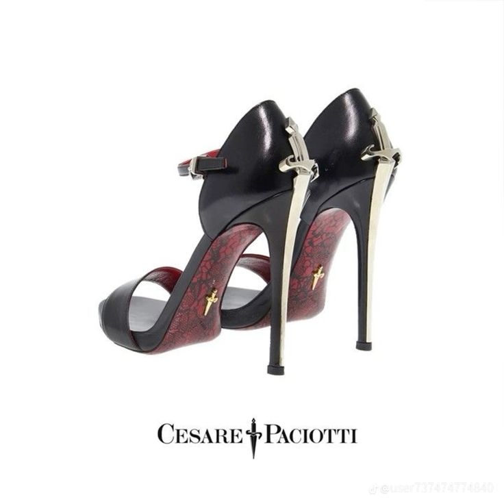 a closeup shot of a pair of cesare paciotti highheeled sandals. the shoes are black with red detailing on the sole and heel, and feature a silver daggershaped accent on the ankle strap.  the heels are tall and slender stilettos. the brand logo is visible at the bottom of the image. the shoes are presented against a white background.