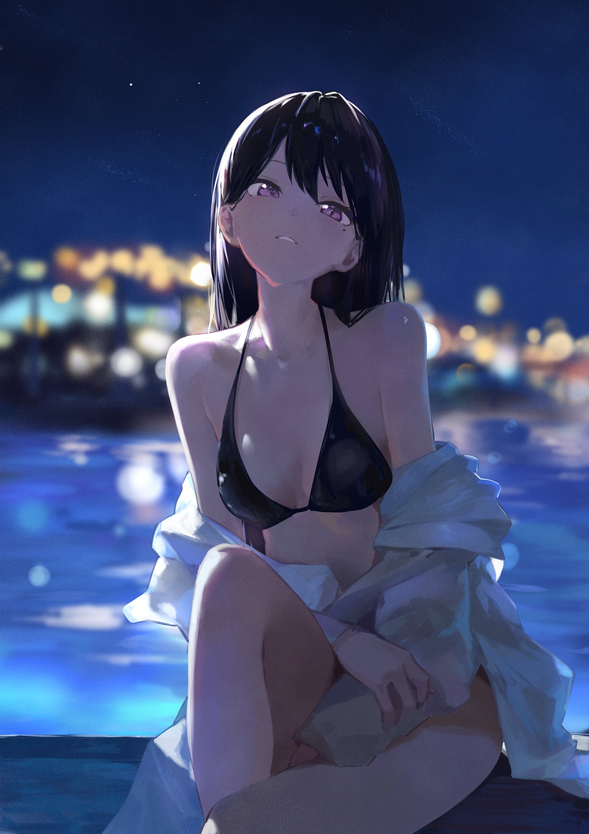 a darkhaired, anime girl wearing a black bikini top and an unbuttoned white shirt is sitting by the water at night. the background features the city lights in the distance. the overall lighting is dim, creating a serene and contemplative atmosphere.  she has purple eyes.