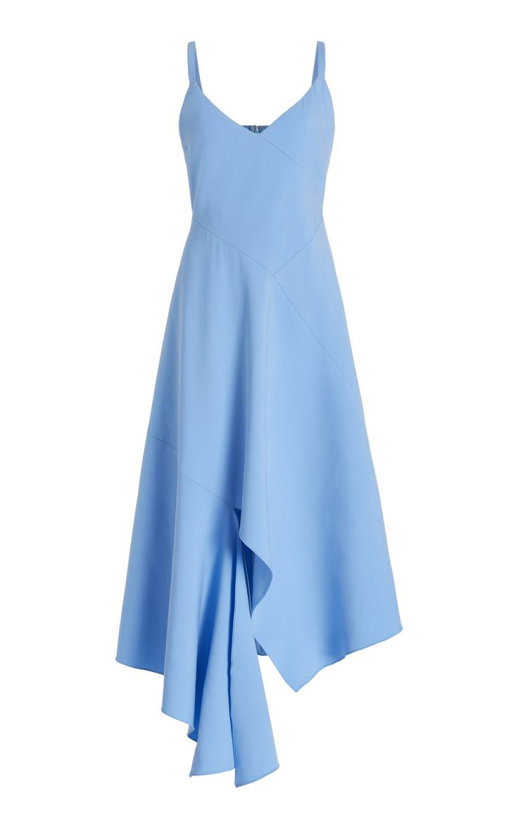 a close up of a blue sleeveless dress, the skirt of the dress is asymmetrical. the dress is styled on a model.