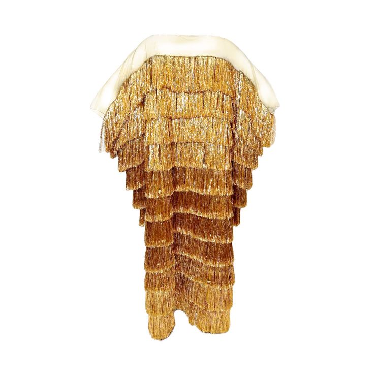 a gold dress with a fringe that is very sparkly and shimmery.  the dress looks elegant and chic.