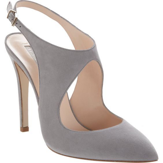 a pair of grey suede pumps with a stiletto heel and a cut out detail. the shoes have a pointed toe and a slingback strap. the shoes are elegant and formal.
