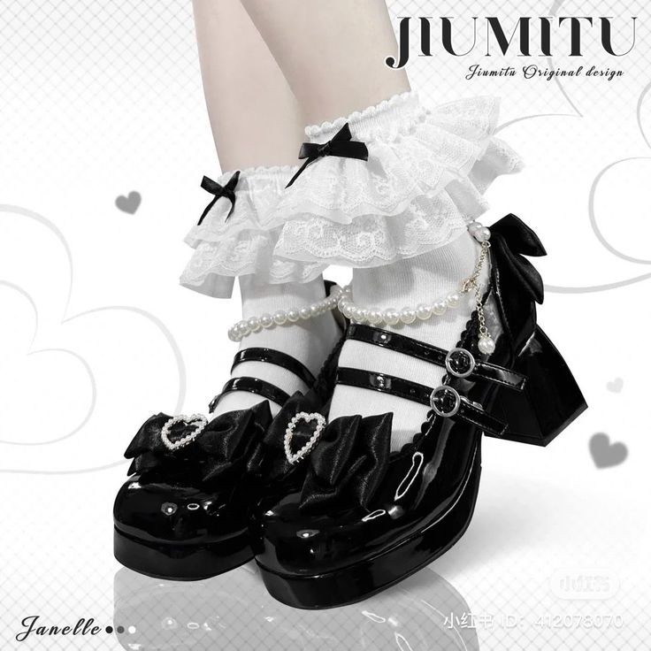 the image shows a pair of black platform mary jane shoes with lolita fashion aesthetics. the shoes have glossy patent leather finish, double straps with buckles, and a decorative bow with a heart detail on the toe. the shoes are paired with white socks adorned with multiple layers of frilly lace and small black bows. a pearl chain is draped around the ankles. the background is light and features subtle heart shapes. the overall style is ornate and delicate.