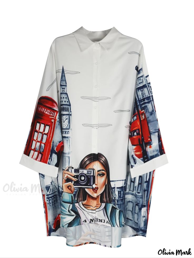 a white shirt with london scenery and a woman holding a camera printed on it. the london scenery includes a red telephone booth, big ben, and a double decker bus. the woman is wearing a shirt that says "a ninja".