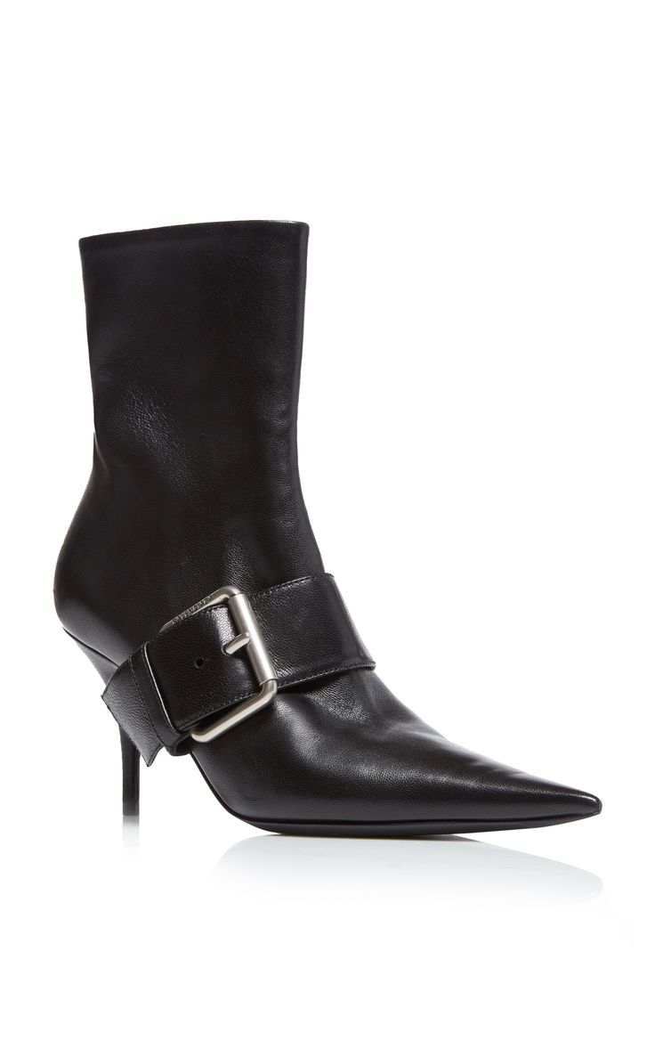 a pair of black leather ankle boots with a pointed toe and a single buckle across the instep.  the boots are on a stiletto heel and appear to be made of highquality leather.  the image is a product shot showing the boots from a slightly angled perspective against a white background.