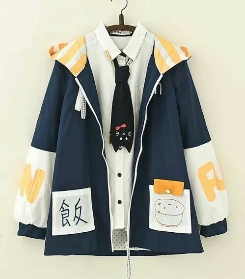 this is an image of a cute, stylish jacket with a hoodie, zipper, and pockets. it features a blue and white color scheme, with a yellow/orange trim. the jacket is decorated with various details, including a pocket with the word "food" on it, and a tie that features a cute, black cat with a red bow. the jacket appears to be made of a lightweight fabric, and is perfect for casual wear.