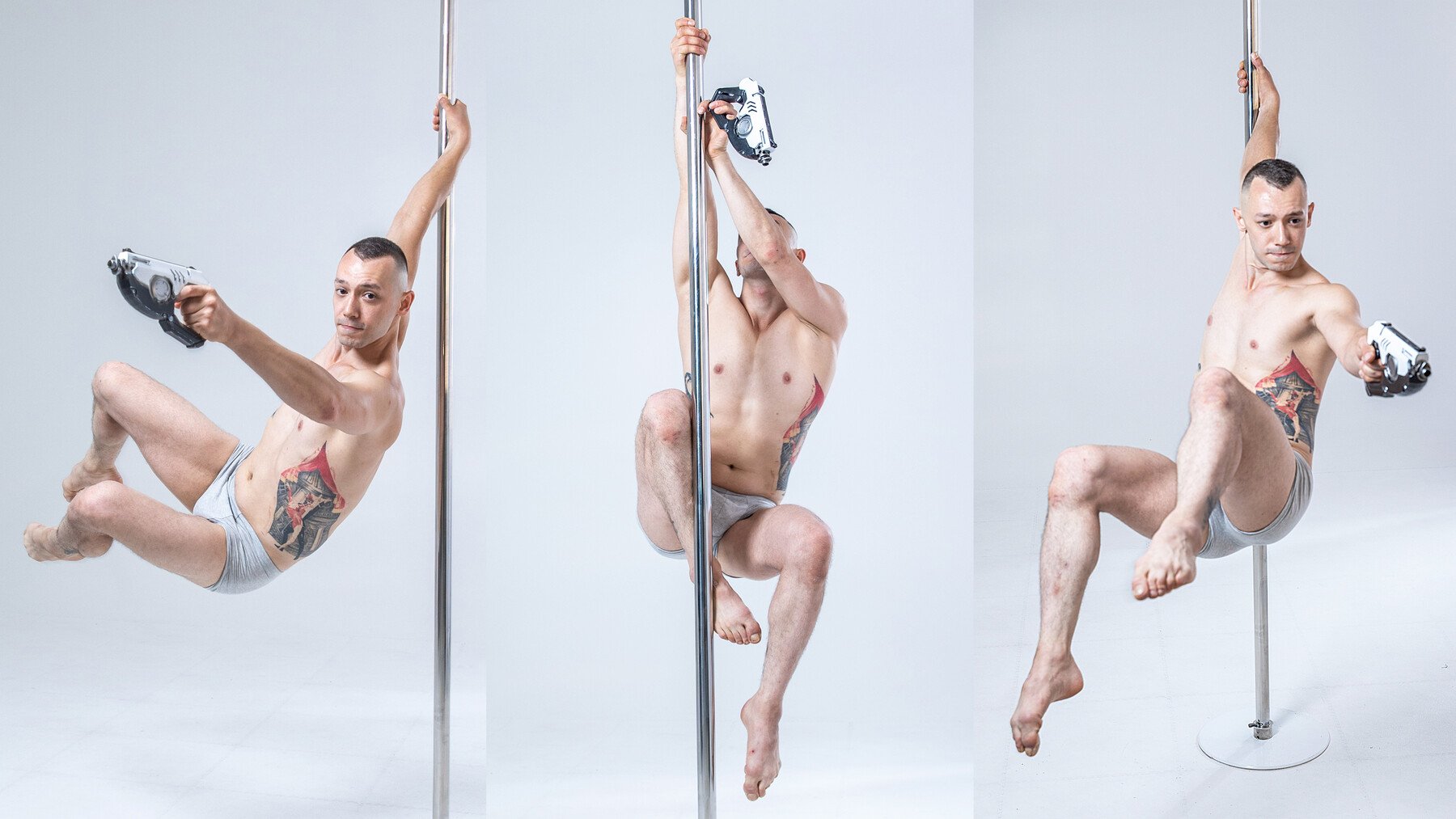 three images of a man posing around a pole, while holding a toy gun in his hand. the man is wearing grey shorts and is shirtless. he is looking directly at the camera in one image. he is  looking off to the side in the other two images. the man is in different poses each time. the pole is silver in colour and is a key element in all three images.