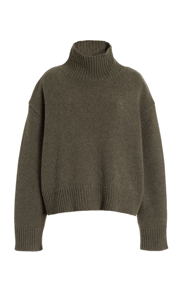 a green turtleneck sweater on a white background. the sweater is a knit and appears to be soft and comfortable. it is longsleeved and looks like it could be worn casually or dressed up.