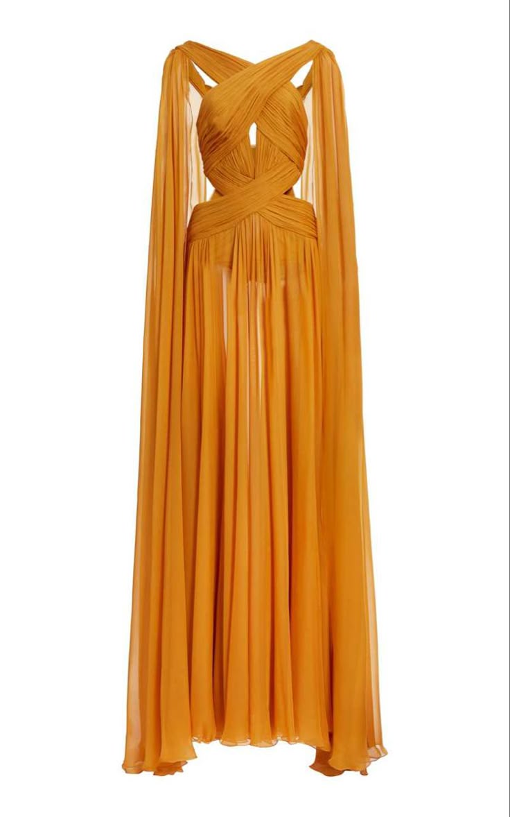 a flowing orange evening gown is displayed against a plain white background. the dress features a crisscross design at the bust with a small cutout detail and cape sleeves that extend to the hem of the dress. the fabric is light and airy, giving the dress a graceful and elegant appearance.