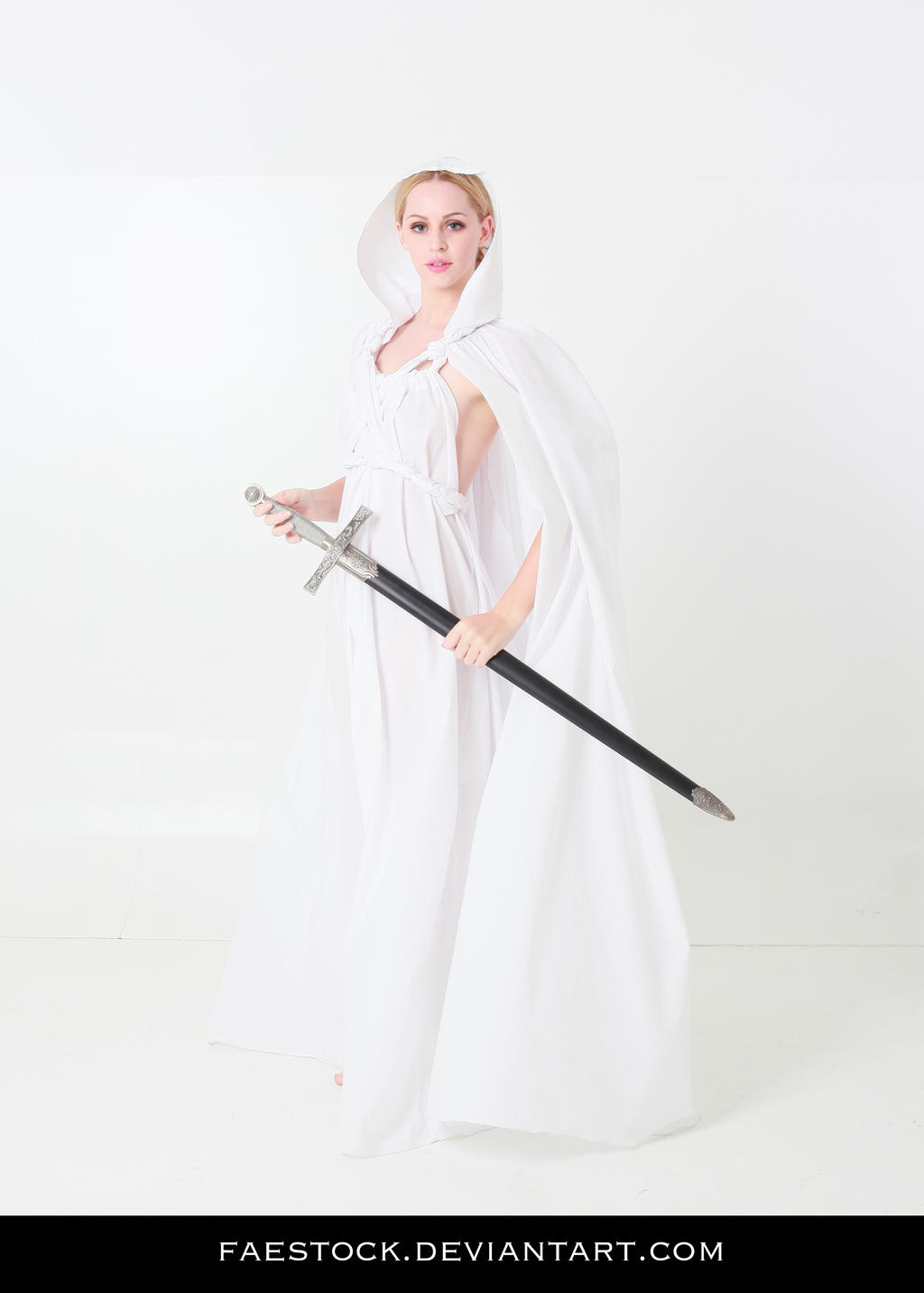 a fullbody shot of a blonde woman in a flowing white hooded cloak and dress, holding a sword.  she is posed in a graceful stance against a plain white background. the overall aesthetic is medieval fantasy or princesslike.
