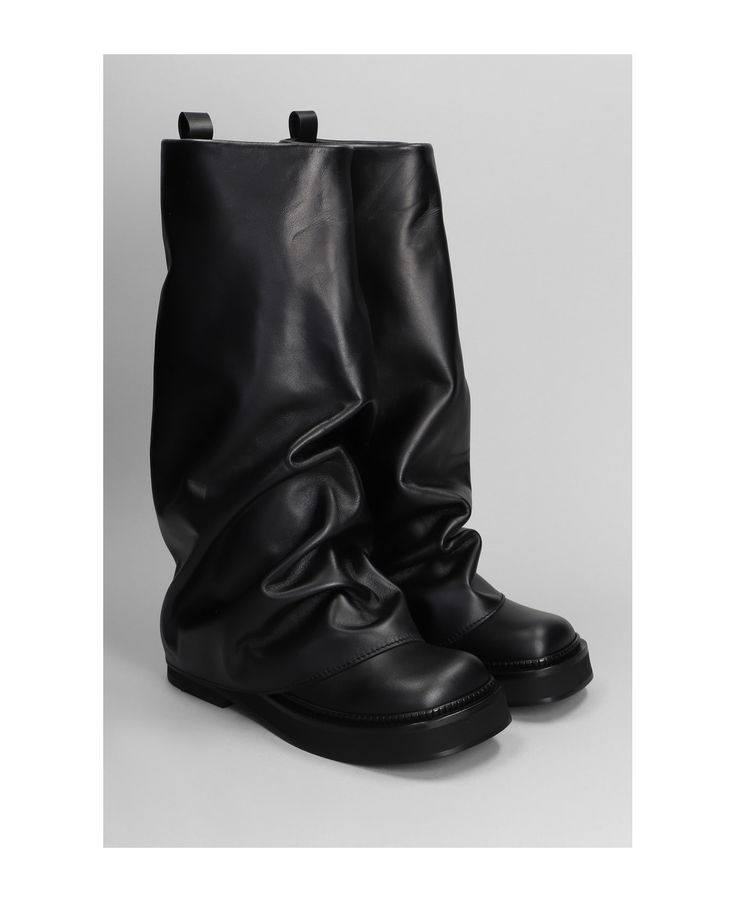 a pair of black leather knee high slouchy boots. the boots are made of a soft, supple leather that has a wrinkled, slouchy look. they feature a chunky heel and a rounded toe. the boots are a stylish and comfortable option for fall and winter.