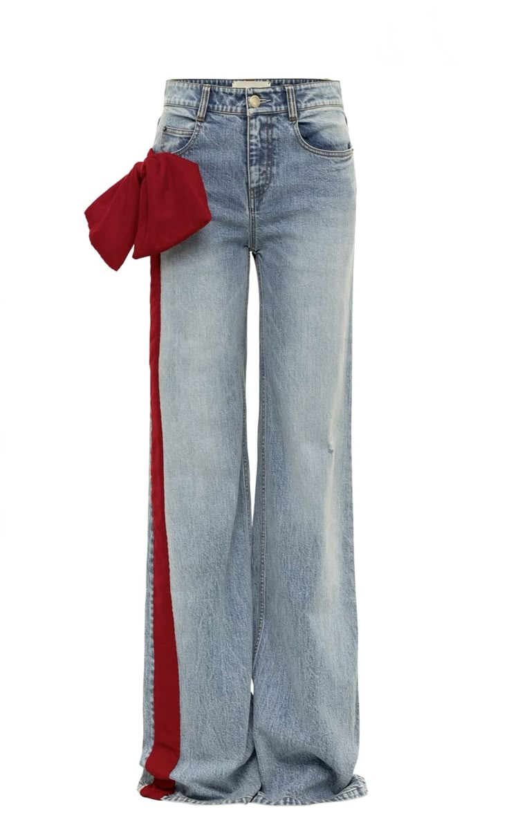 a pair of light wash, highwaisted, wideleg denim jeans with a large red bow and red fabric stripe on the left leg is isolated on a white background.