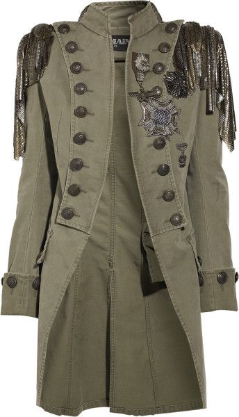 a green military style jacket with gold buttons and gold embellishment on the shoulders.