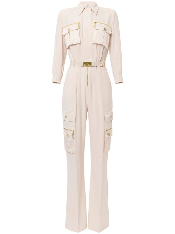 a white longsleeved jumpsuit with a collared neckline, belted waist, and cargo pockets. the jumpsuit has a relaxed and comfortable fit, with a slightly flared leg. it is perfect for a casual or semiformal event. the jumpsuit is made from a highquality material and features a highquality craftsmanship, adding to its overall elegance.