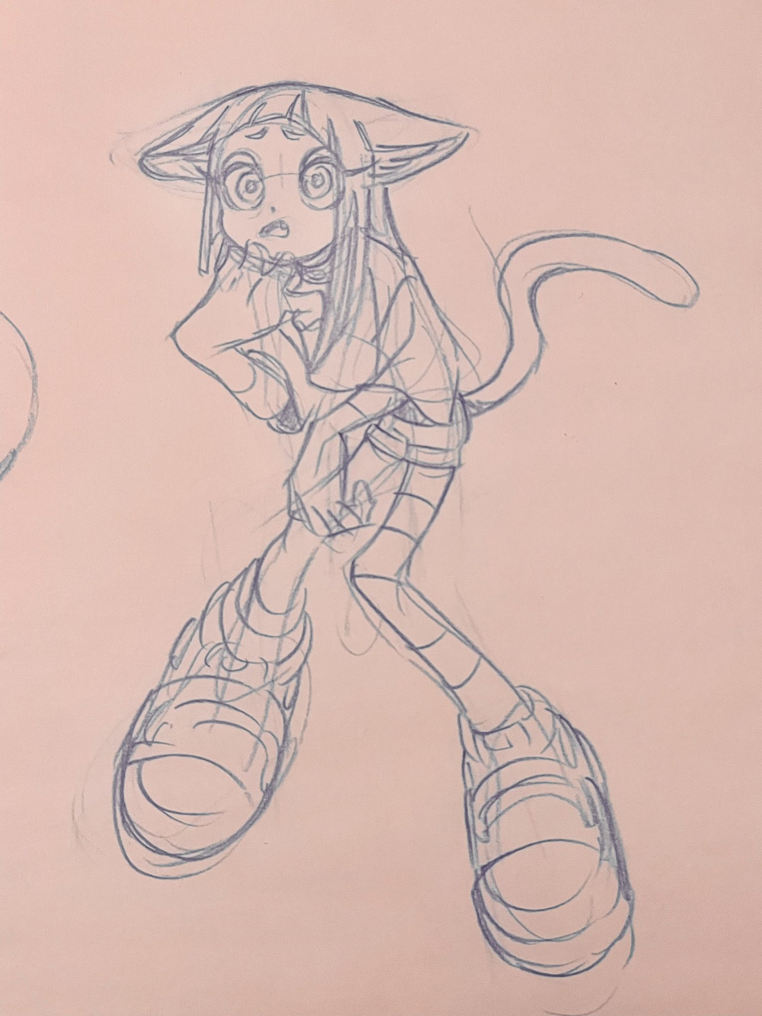 a pencil sketch of a surprisedlooking cat girl drawn on pink paper.