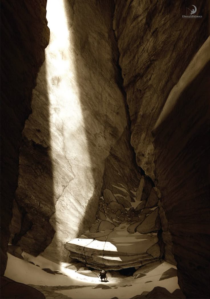 the image is a sepiatoned illustration of a deep canyon with a beam of sunlight shining down from above. the canyon walls are steep and rocky, with shadows adding depth and texture. at the bottom of the canyon, a small figure stands on a rock, seemingly dwarfed by the vastness of the space. the image has a sense of solitude and awe, and it appears to be a concept artwork of a scene from a dreamworks movie.