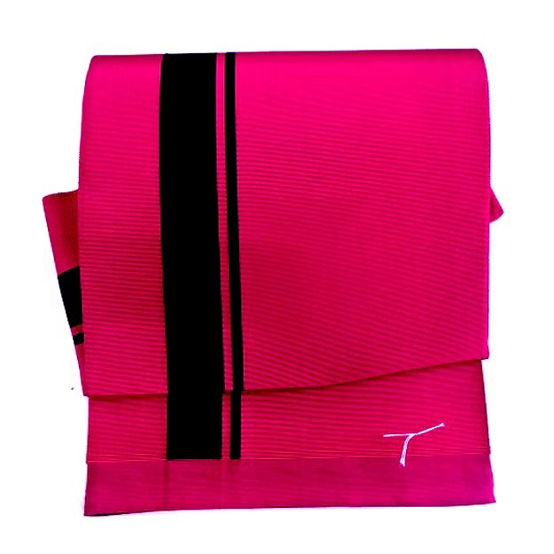 a bright fuchsia kimono obi belt with black vertical stripes and folded over itself, resting on a white surface.