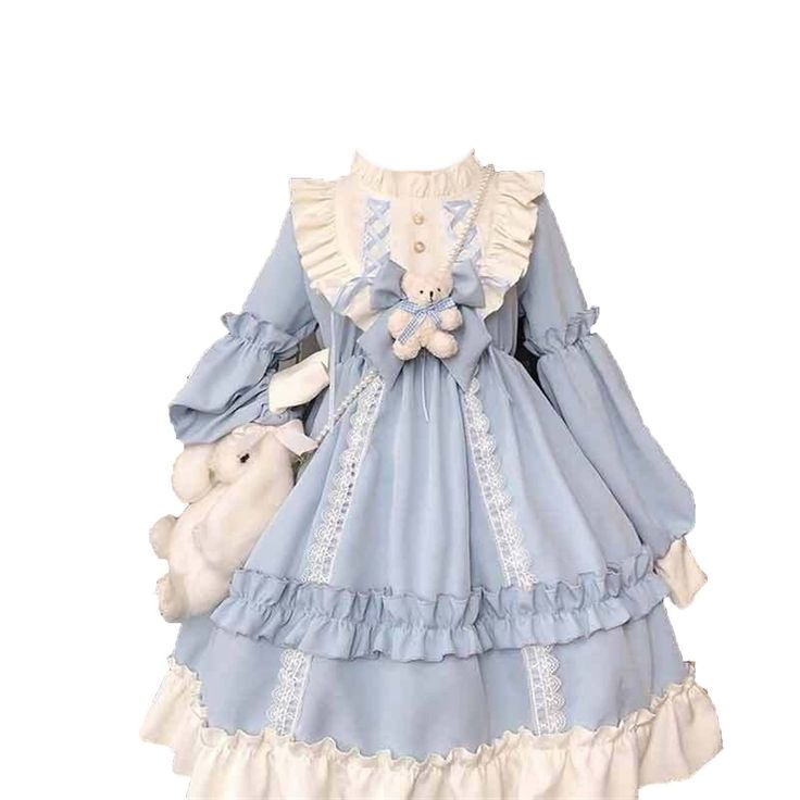 a blue and white lolita fashion dress is shown against a white background. the dress features a layered skirt with ruffles, a teddy bear attached to the bodice, and a matching teddy bear purse.