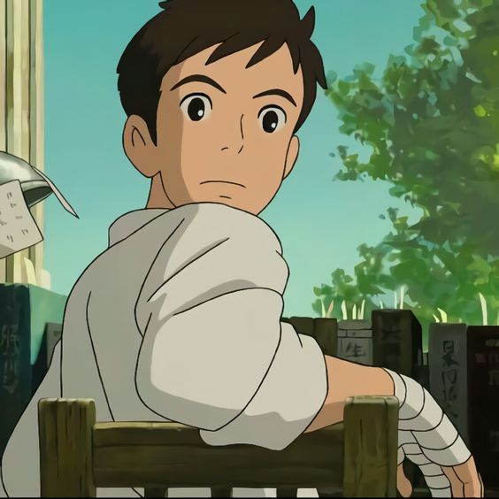 the image shows a young man, drawn in an anime style, sitting in a chair with his back to the viewer.  he is wearing a white shirt and has a bandage on his right hand. he is turned slightly to the side, looking out of the frame with a thoughtful expression on his face. the background suggests he is indoors, possibly in a classroom or library, with books visible on shelves behind him. the lighting is soft and natural, likely coming from a window off to the side.