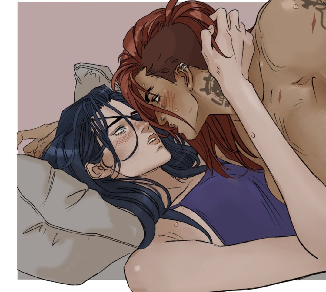 an illustration of two women kissing intimately in bed. the woman on the left is lying down, and has long dark hair, and a blue top. the woman on the right is standing/leaning over her, has short red hair, is shirtless, and has tattoos. they are both looking into each other's eyes.