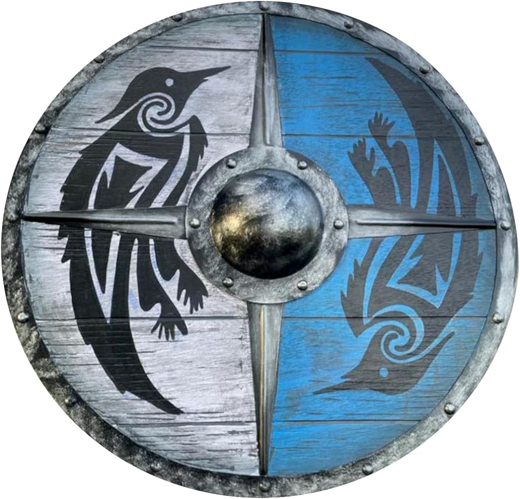 a round viking shield, divided into four quadrants. two opposing quadrants are painted blue with a black raven design, while the other two quadrants are gray with white raven designs. the central boss is metallic and surrounded by rivets.
